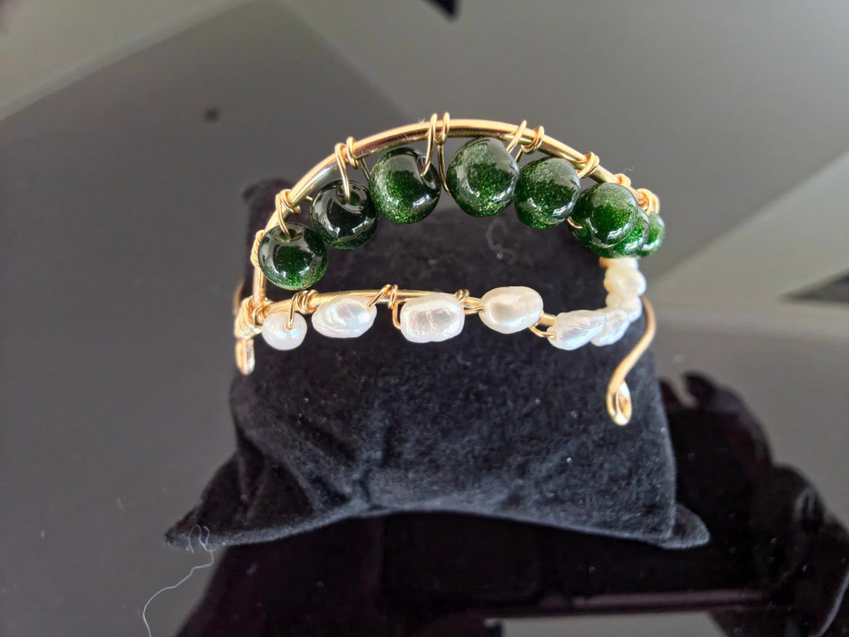 Front view of handmade green glass and freshwater pearl cuff